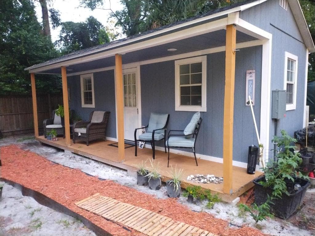 Tiny home barn style in backyard with Animals